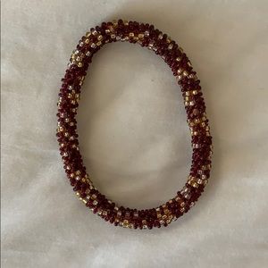 Red, gold and white beaded bracelet